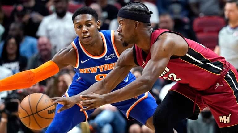 Heat forward Jimmy Butler passes the ball as Knicks guard...