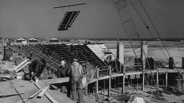 A view of the Nassau Coliseum under construction as an...