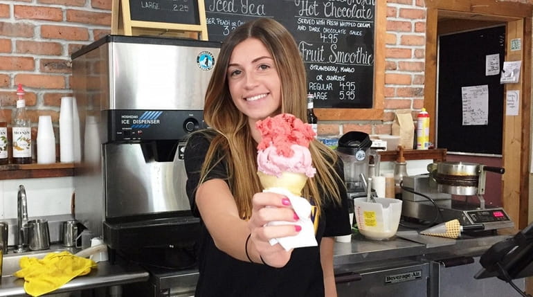 Samantha Petersen serves up a cone at Gooseberry Grove in...