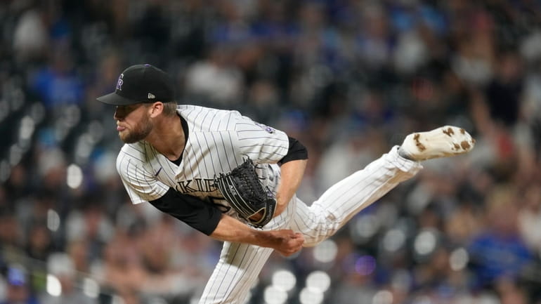 Colorado Rockies relief pitcher Daniel Bard delivers in the ninth...