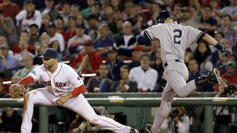 New York Yankees' Derek Jeter (2) tries to beat out...