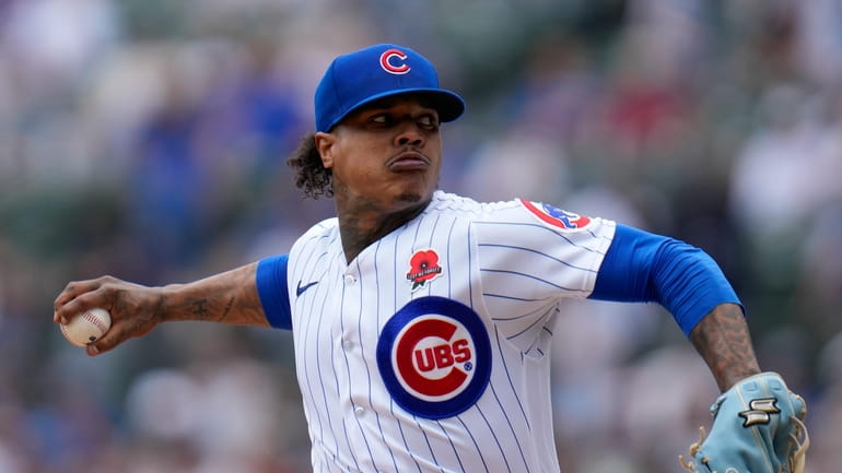 Chicago Cubs starting pitcher Marcus Stroman throws during the first...