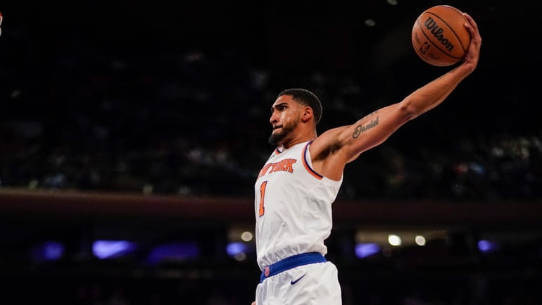 New York Knicks forward Obi Toppin leaps to dunk against...