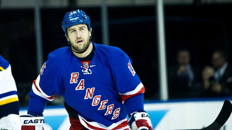 New York Rangers left wing Tanner Glass (15) reacts after...