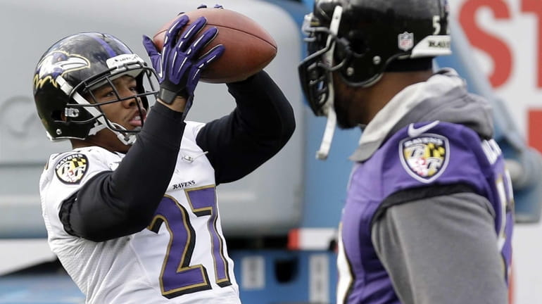 Baltimore Ravens running back Ray Rice, left, catches a pass...
