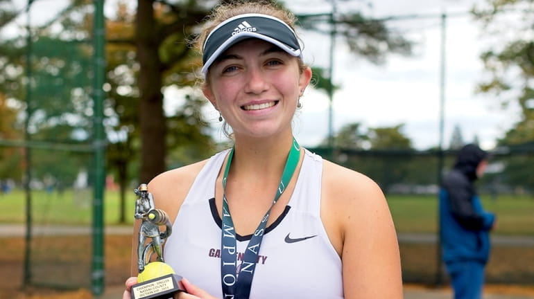 Garden City’s Nina Wiese wins the girls singles championship during...