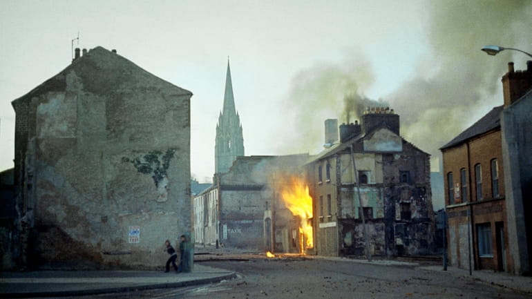 In this February 1972 file photo, a building burns in...