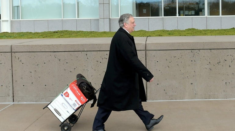 Edward Mangano arrives at the federal courthouse in Central Islip...