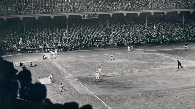 Brooklyn Dodgers photographed during night game at Ebbets Field on...