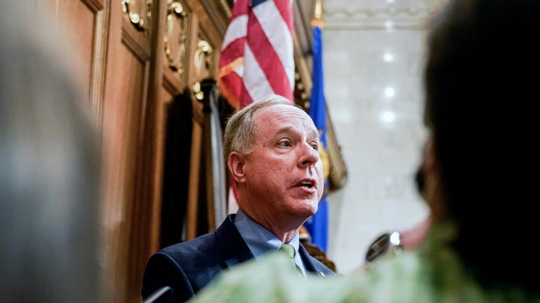 Wisconsin's Republican Assembly Speaker Robin Vos talks to the media...