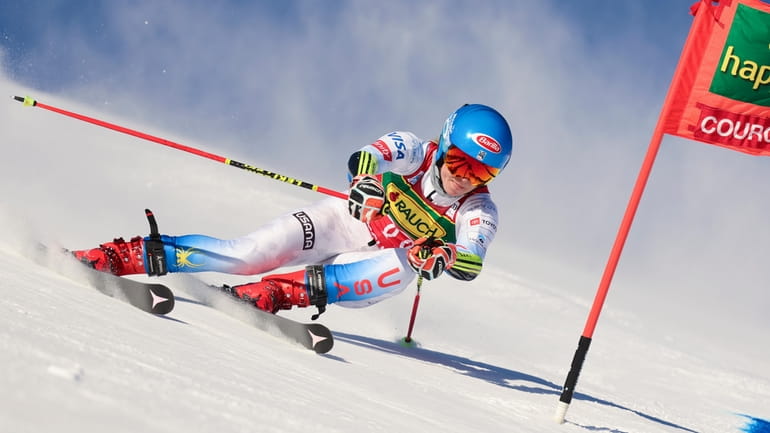 FILE - Mikaela Shiffrin speeds down the slope during the...