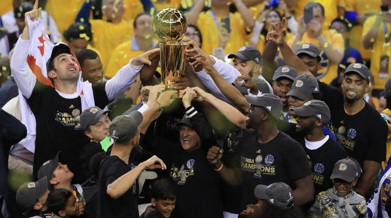 The Golden State Warriors celebrate with the Larry O'Brien Championship...