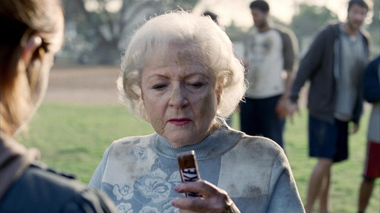 Betty White is featured in a Snickers candy bar commercial,...
