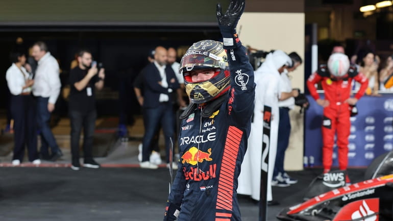 Red Bull driver Max Verstappen of the Netherlands waves after...