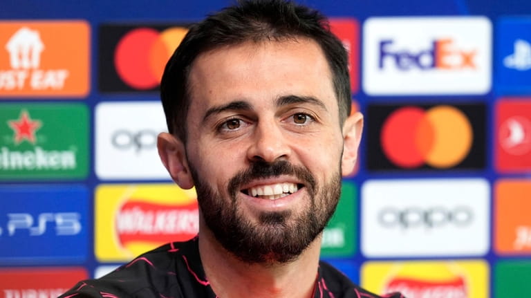 Manchester City's Bernardo Silva speaks during a press conference at...