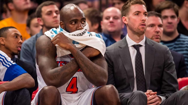 New York Knicks forward Quincy Acy sits on the bench...