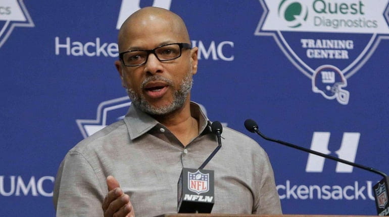 New York Giants general manager Jerry Reese responds to a...