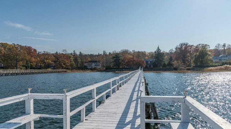 The Oyster Bay Cove estate has two acres, a deepwater...