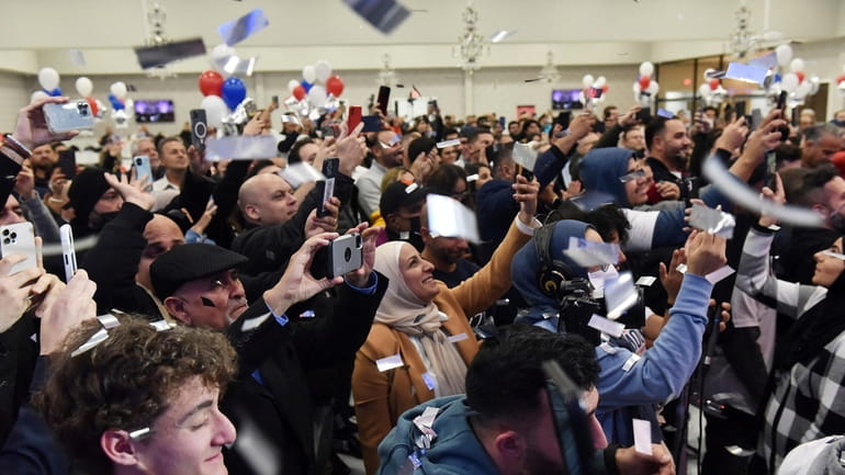 Confetti flies as Dearborn mayor candidate Abdullah Hammoud prepares to...