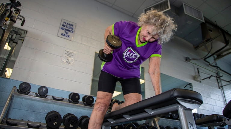 Sondra Rose works out on with weights at the Long...