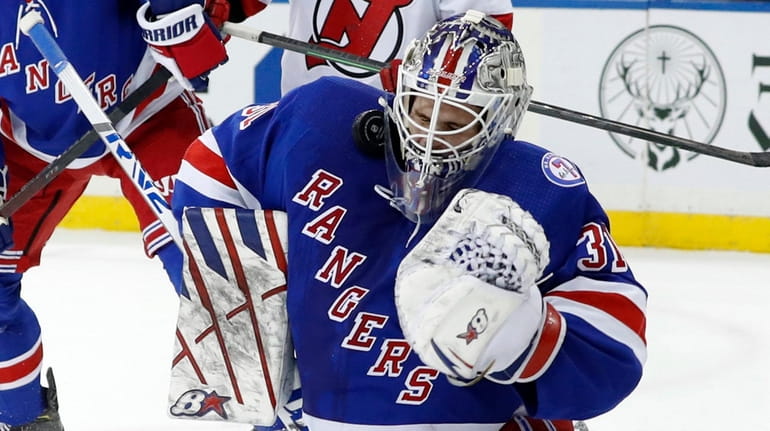 Igor Shesterkin of the Rangers makes a save during the...