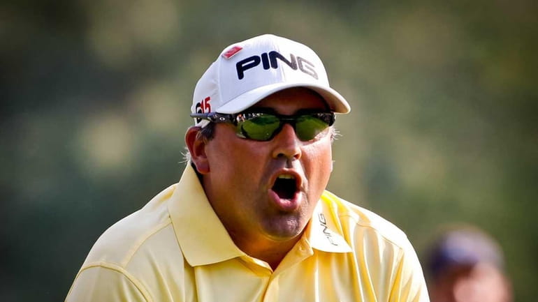 Angel Cabrera talks to his ball after hitting his tee...