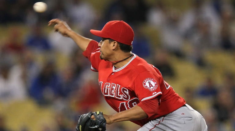 Reliever Ernesto Frieri #49 of the Los Angeles Angels of...