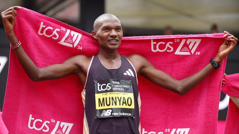 Alexander Mutiso Munyao of Kenya reacts after winning the men's...