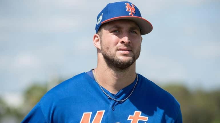 Mets outfielder Tim Tebow looks on during a spring training...