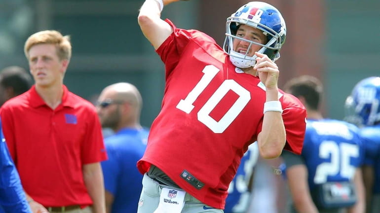 Giants quarterback Eli Manning throws a pass during training camp...
