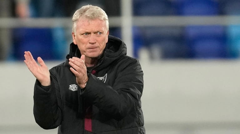 West Ham's manager David Moyes applaud supporters at the end...