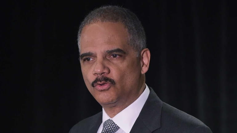 Attorney Eric Holder delivers the keynote address at the National...