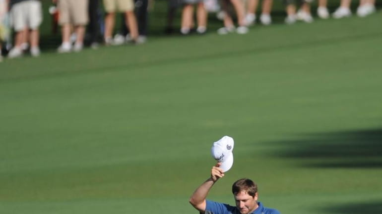 Steve Marino acknowledges the gallery after sinking the ball from...