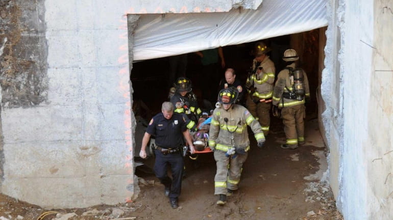 Responders conduct a search after a ceiling collapse at a...