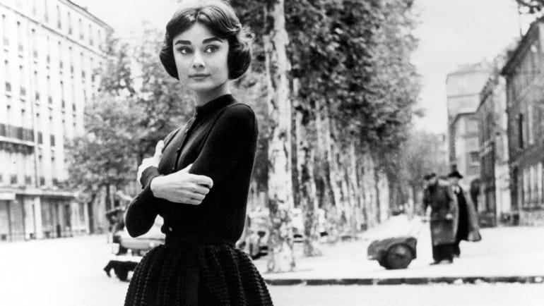 Audrey Hepburn on the streets of Paris during her off...