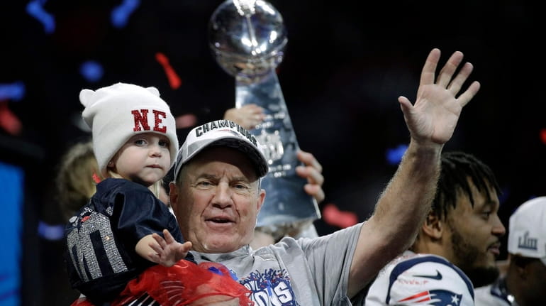 New England Patriots head coach Bill Belichick waves after Super...