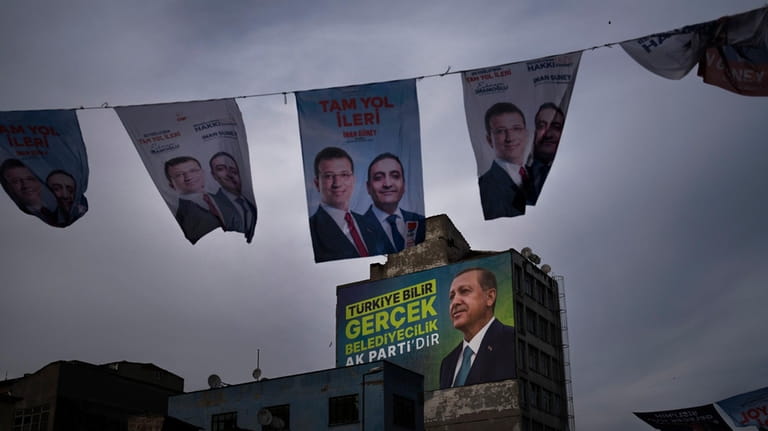 Banners of Turkish President and leader of the Justice and...