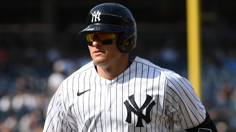 Yankees third baseman Josh Donaldson returns to the dugout after...