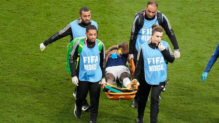 Ecuador's Enner Valencia is taken away with stretcher during the...