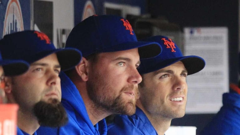 New York Mets' David Wright, right, watches the sixth inning...