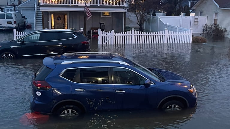 The vehicle owned by Ashley Egan is stranded in floodwaters on...