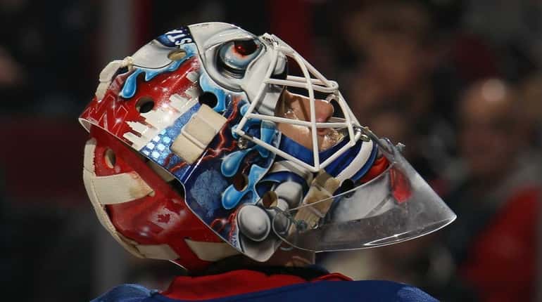 Cam Talbot of the Rangers takes a break during the...