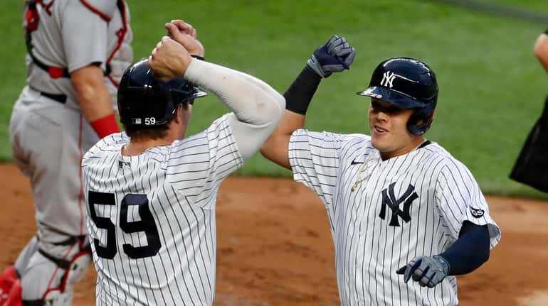 Gio Urshela #29 of the Yankees celebrates his first inning...