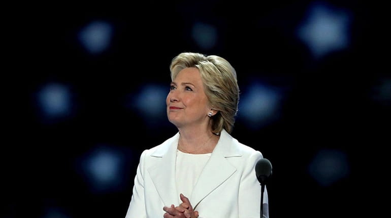 Democratic presidential nominee Hillary Clinton acknowledges the crowd as she...
