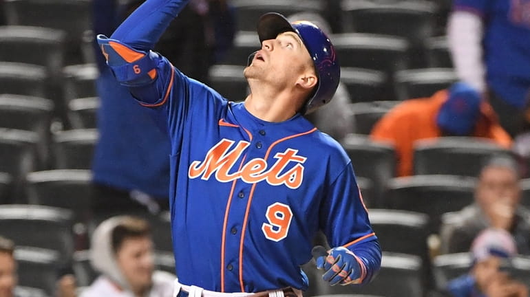 The Mets' Brandon Nimmo reacts after he scored a solo...