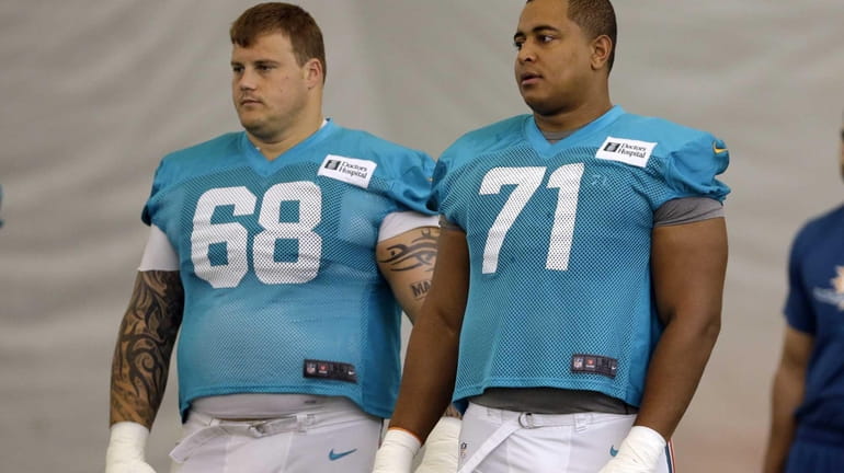 Miami Dolphins guard Richie Incognito, left, and tackle Jonathan Martin...