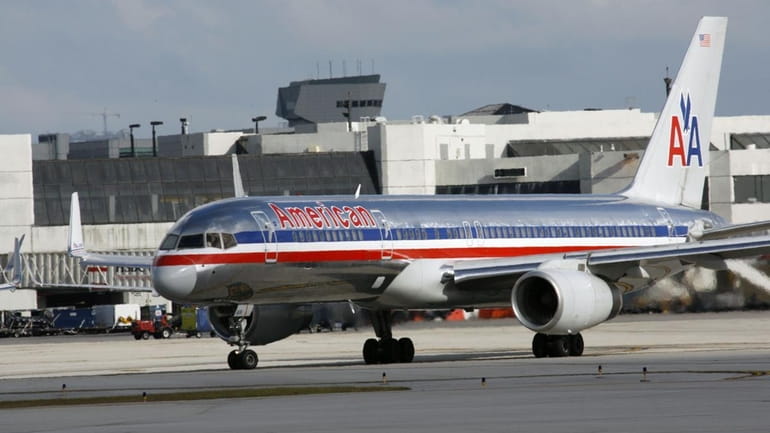 An American Airlines plane is shown at Miami International Airport...