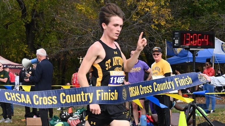 Aiden Brancaccio from St. Anthony's crosses the finish line in first...