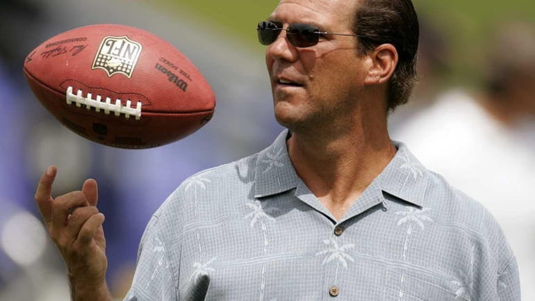 Baltimore Ravens owner Steve Bisciotti tosses a football during the...