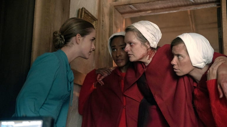 Elisabeth Moss (center) in Hulu's "The Handmaid's Tale." 